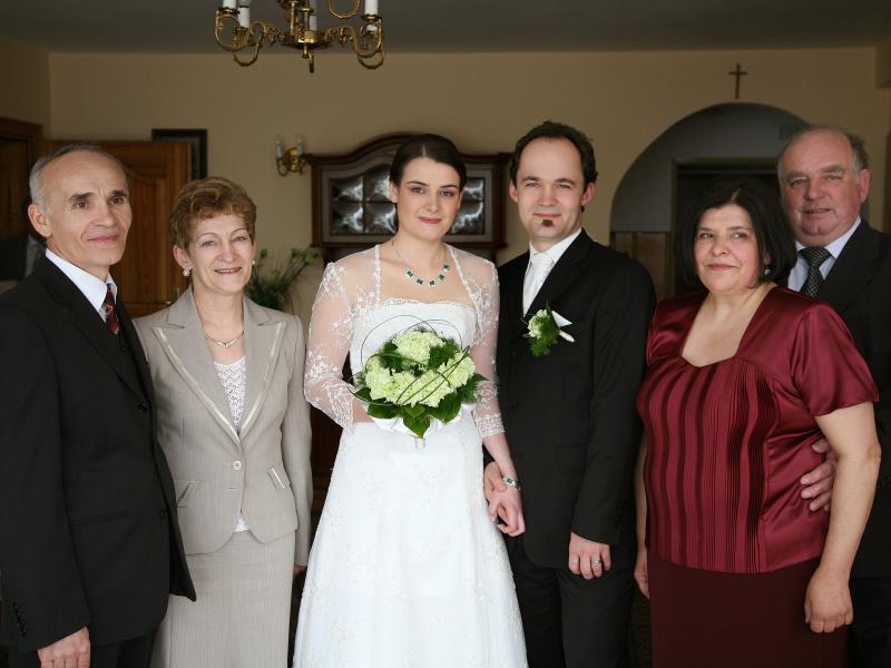 Agata and Roman, flanked by their parents.