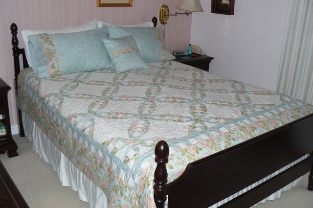 Shot of the quilt on bed at Taffy's, from the side of the bed.
