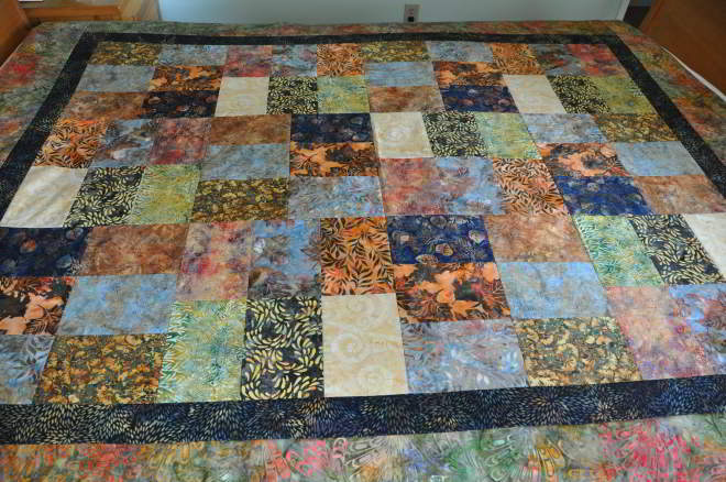 View of quilt top from the side of the bed.