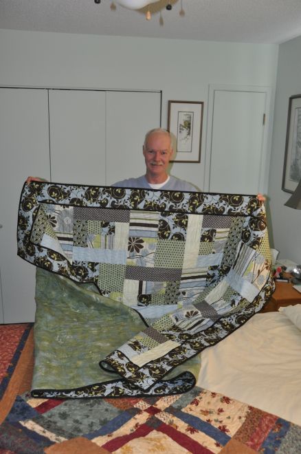 Bill accepts his gift of the City Slicker quilt.