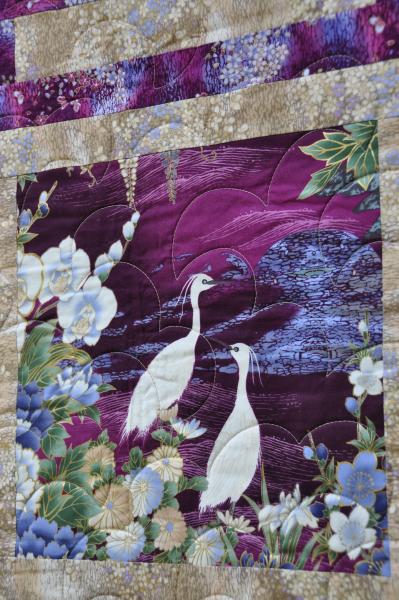 Close up of a crane block on Crane Paradise quilt.