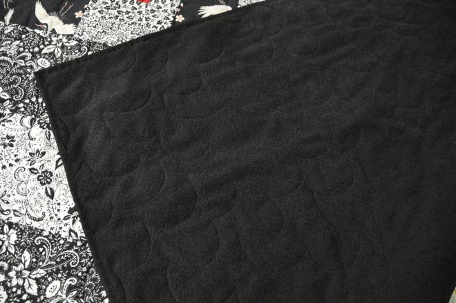 A shot of the back of the quilt inspired by the crane fabric, and Debbie Maddy's pattern.