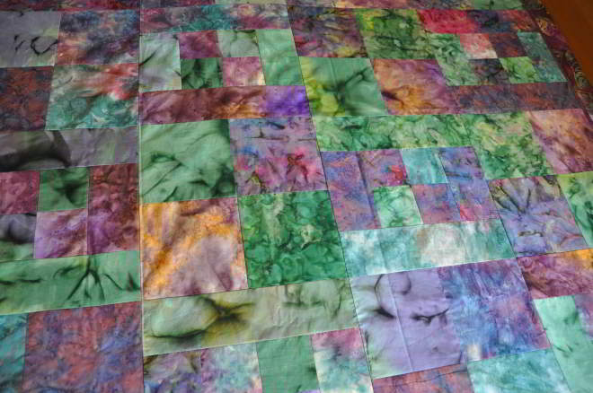 A shot of the center of the quilt top offering a better look at the batks used in it.