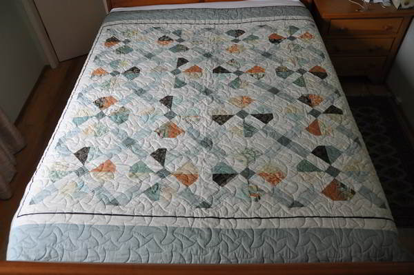 Close up a corner showing some of the fabrics. As well as a better look at the innor and outer borders.