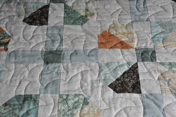 Close up a fabrics and quilt pattern
