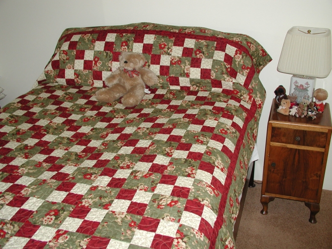 Basic four patch pattern called Four-Get Me Not. Barbara's second quilt.