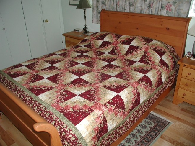 The very pink and violet Floral Chain quilt, from a kit purchased at Village Quilts in Lethbridge in June 2007.