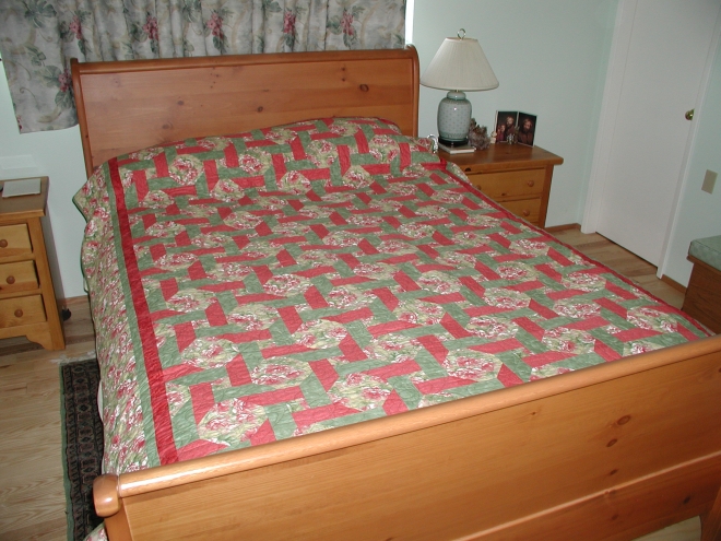 A very pink and green Ring Around the Posies quilt. Design by Tammy Kelly, fabric by Ro Gregg and Northcott Silk Inc.