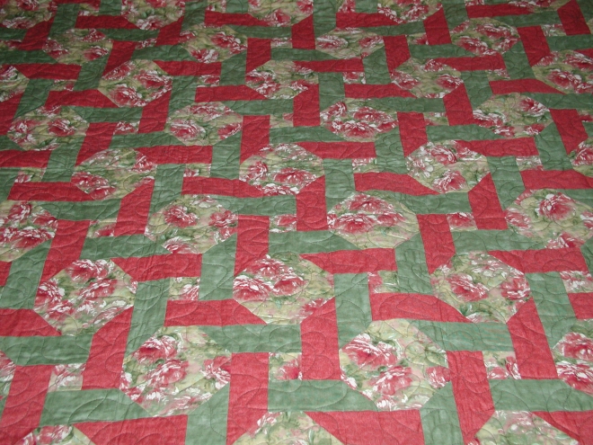 A very pink and green Ring Around the Posies quilt. Design by Tammy Kelly, fabric by Ro Gregg and Northcott Silk Inc.