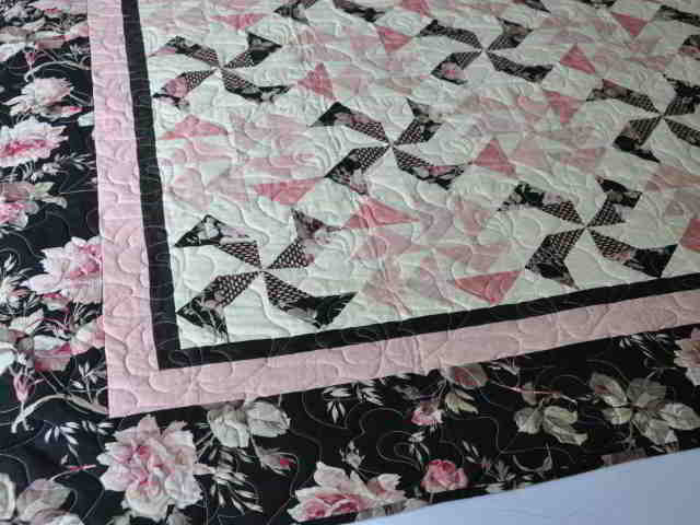 Green and white log cabin quilt, Barn Raising pattern.